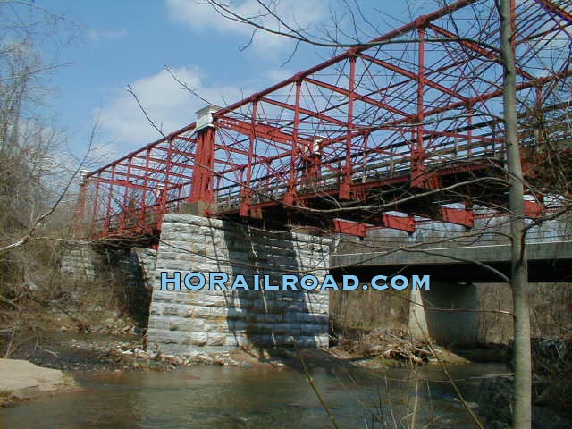 Granite pier supporting iron bridge