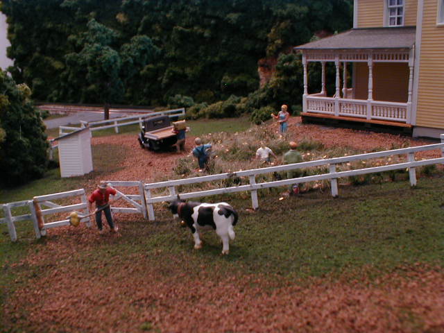 farm house fence and cow